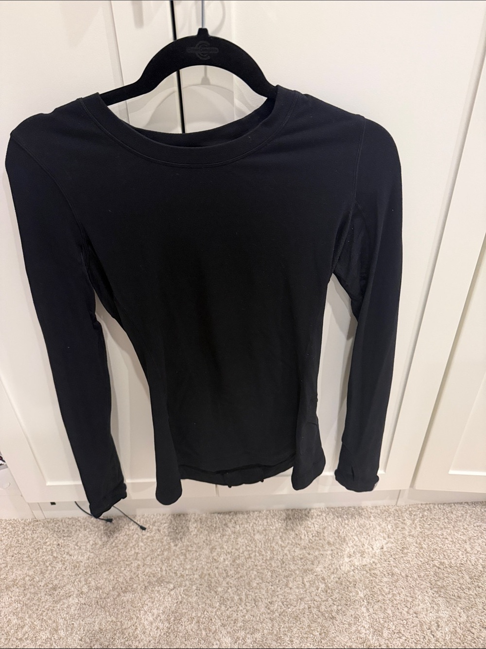 Lululemon black long sleeve ruffle back top size 6. Good condition.